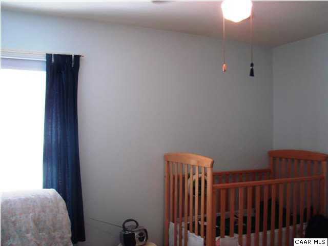 833 Harris Road Charlottesville, VA 22902 - Photo 11 of 21 Bedroom #2 with ceiling fan and large closet.