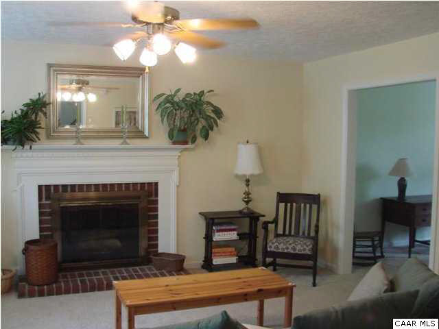 833 Harris Road Charlottesville, VA 22902 - Photo 2 of 21 The spacious Great Room is bright and features a wood-burning fireplace.