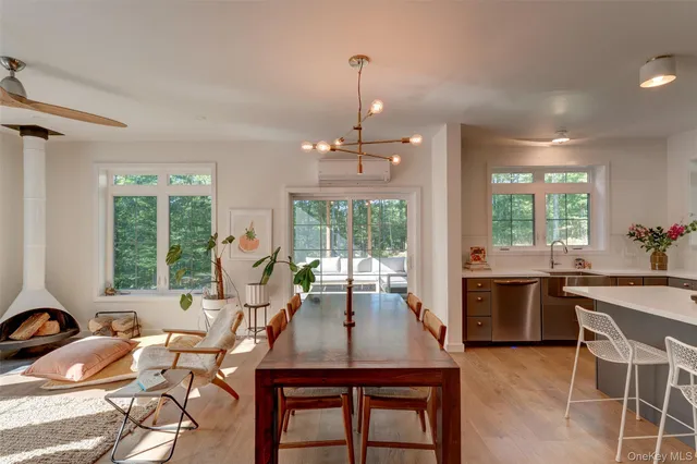 a view of a dining room with furniture window and outside view