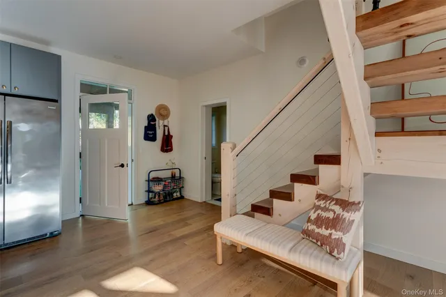 a living room with furniture and a mirror