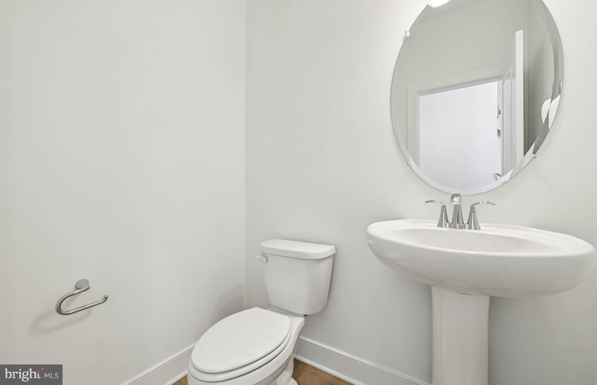 4716 Bellrock Alley Boyds, MD 20841 - Photo 12 of 47 a bathroom with a toilet a sink and mirror