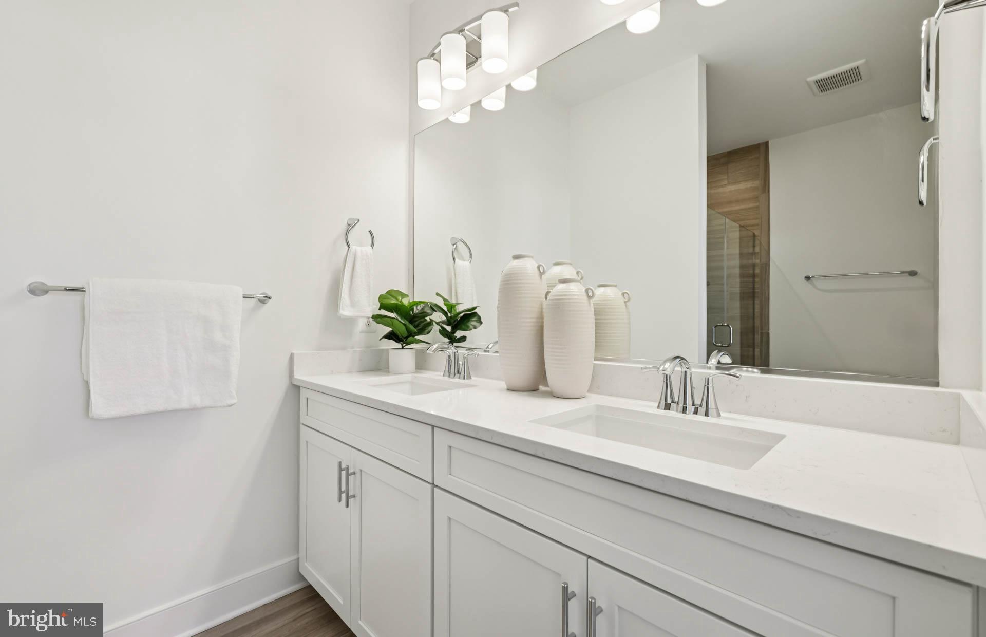 4716 Bellrock Alley Boyds, MD 20841 - Photo 15 of 47 a bathroom with a sink a mirror and a light fixture