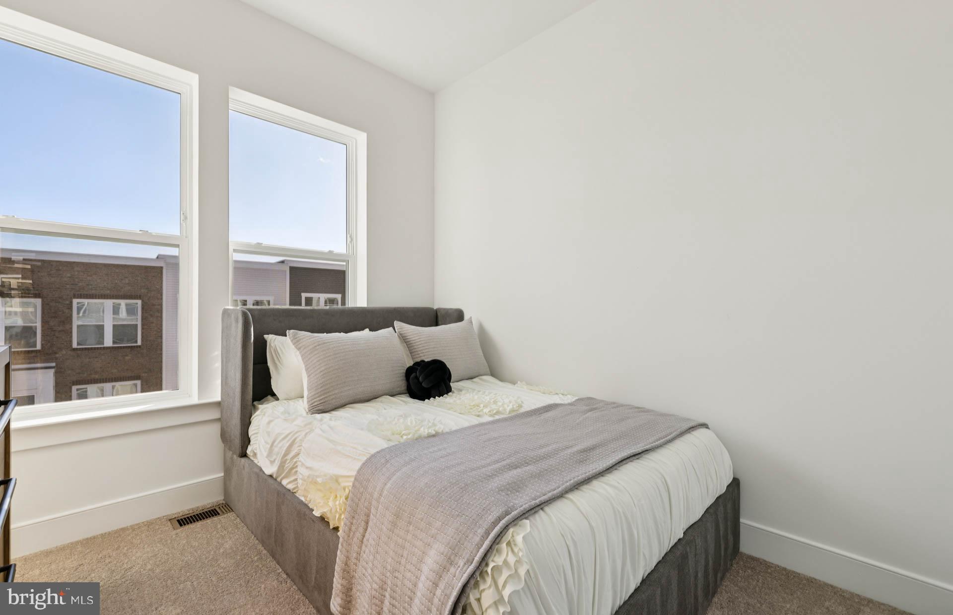 4716 Bellrock Alley Boyds, MD 20841 - Photo 19 of 47 a bedroom with a large bed and a window