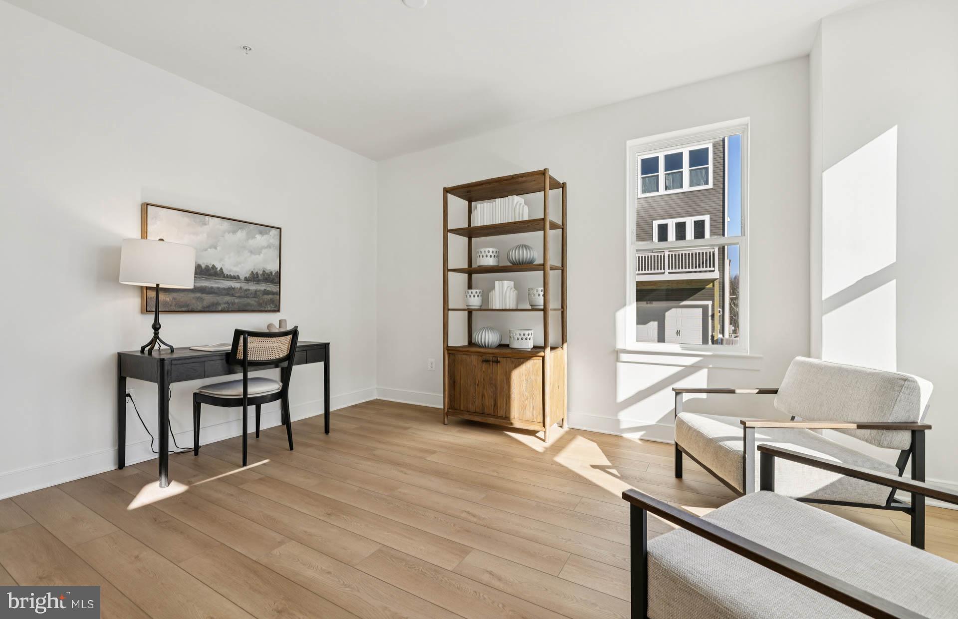 4716 Bellrock Alley Boyds, MD 20841 - Photo 3 of 47 a living room with furniture and a wooden floor