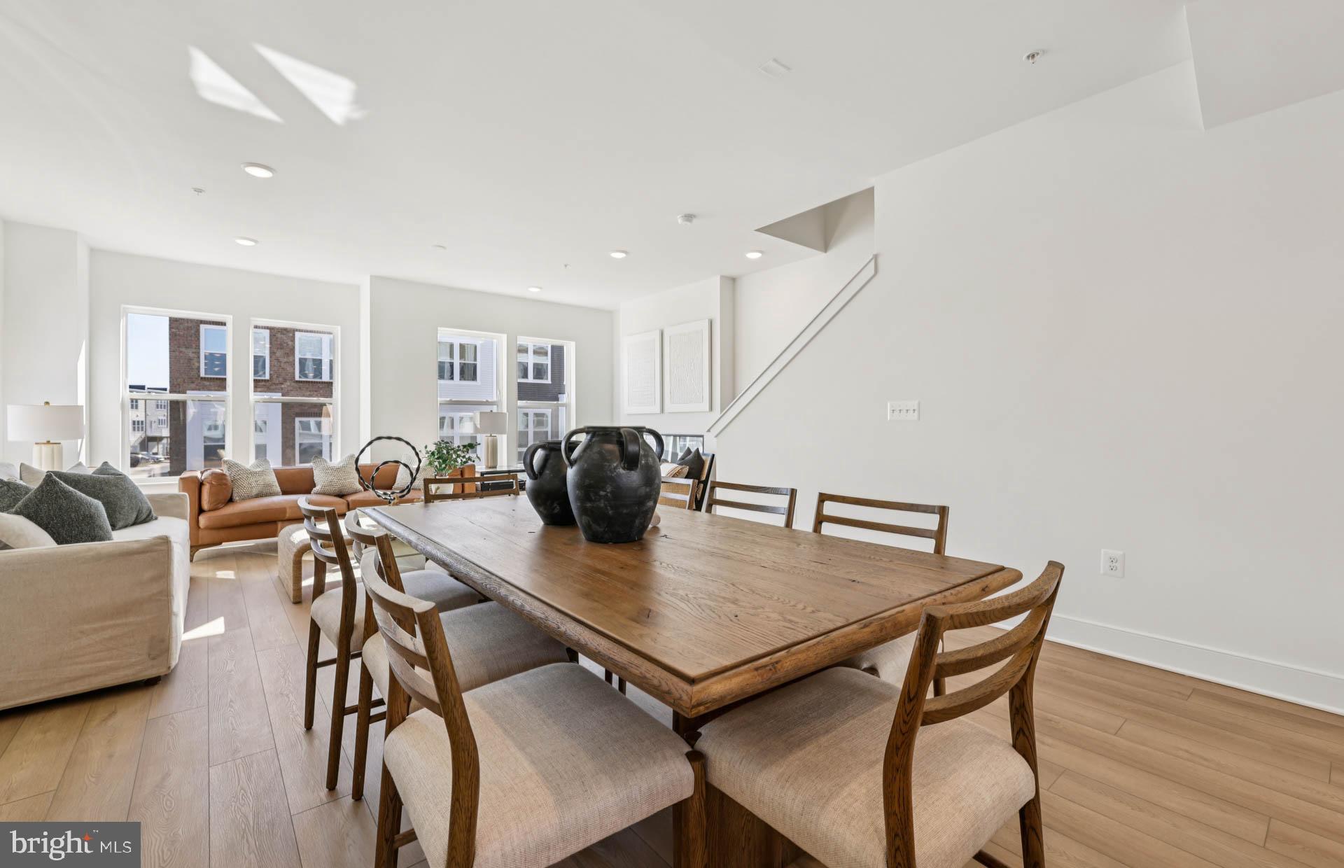 4716 Bellrock Alley Boyds, MD 20841 - Photo 6 of 47 a view of a dining room with furniture and wooden floor
