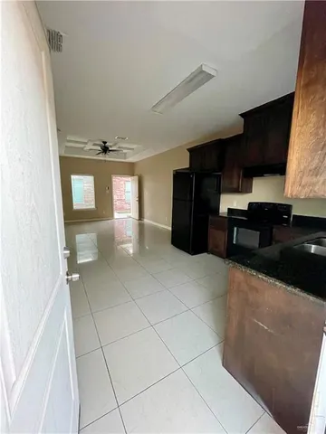 a view of kitchen with furniture and window