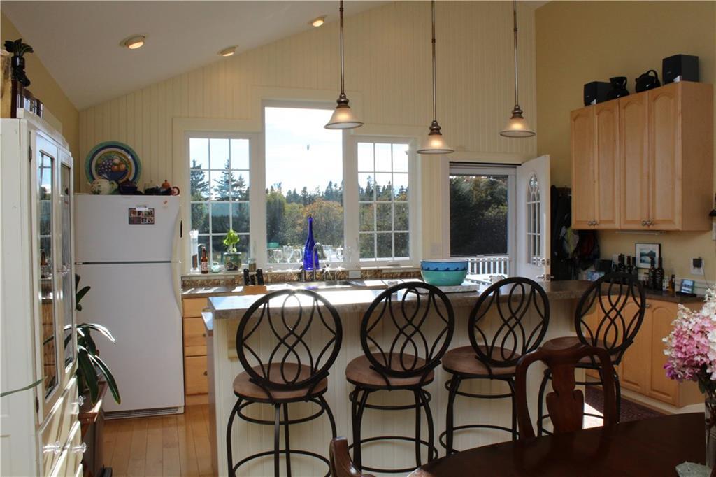 98 Carrying Place Cove Road Lubec, ME 04652 - Photo 19 of 35 View of the kitchen from the living...