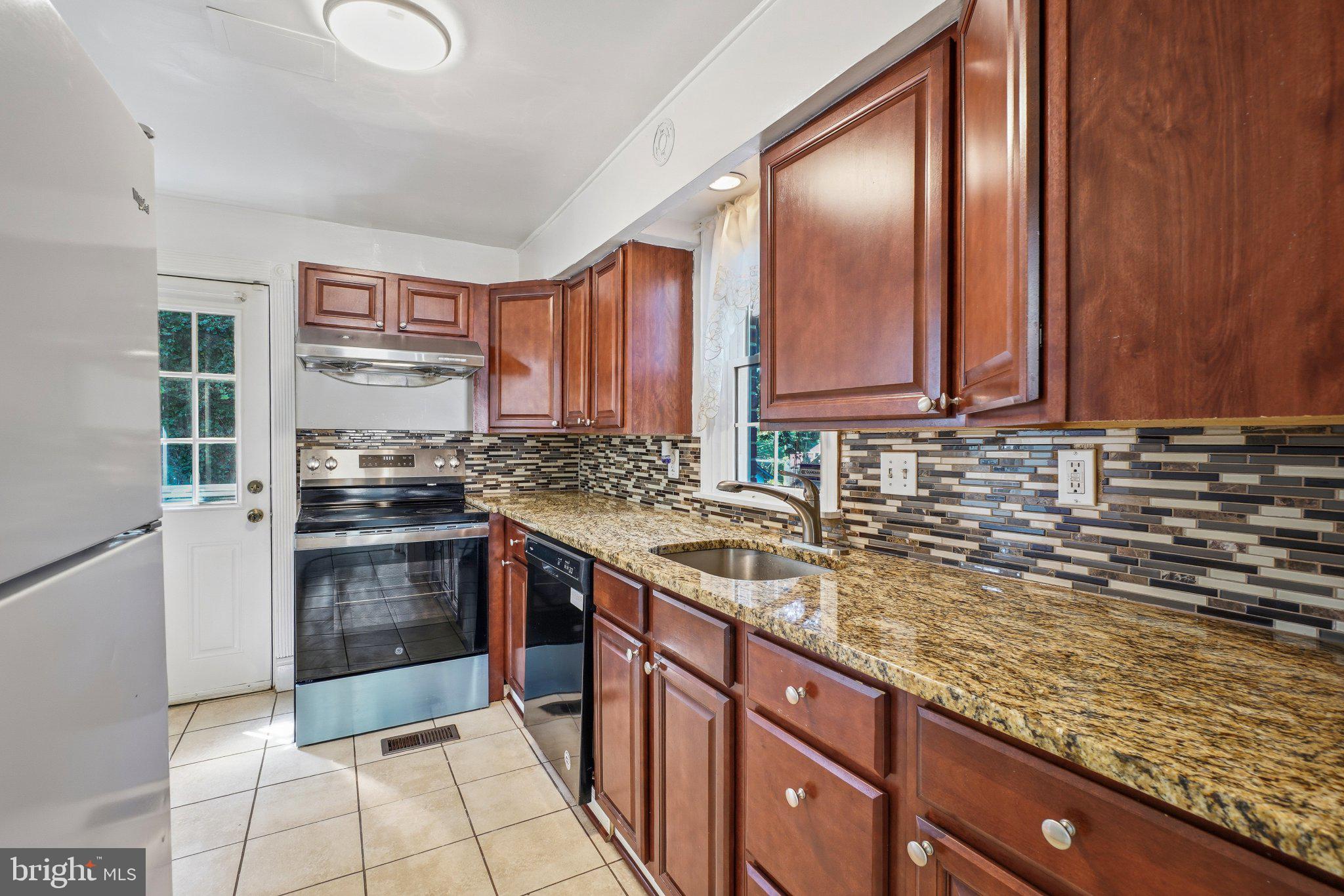 7022 Deerfield Road Pikesville, MD 21208 - Photo 14 of 30 Charming kitchen with modern finishes.