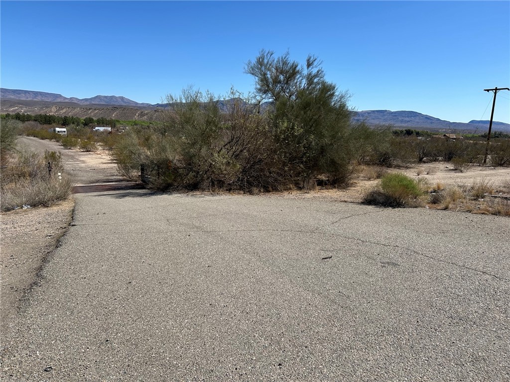 93 Wikieup Az 85360 Wikieup, AZ 85360 - Photo 3 of 6 View of asphalt road with a mountain view