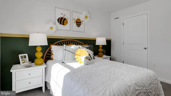 a bedroom with a bed and dresser