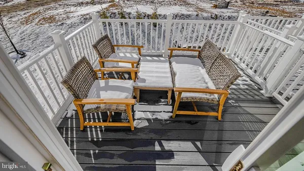 a view of a balcony with furniture