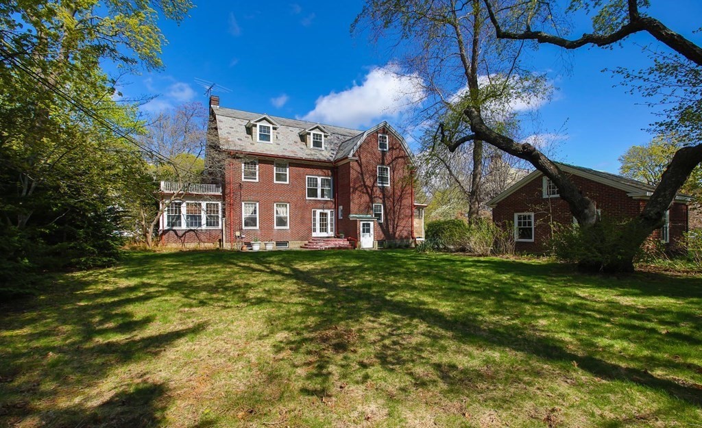260 Dean Road Brookline, MA 02445 - Photo 12 of 14 a view of a house with a big yard plants and large trees