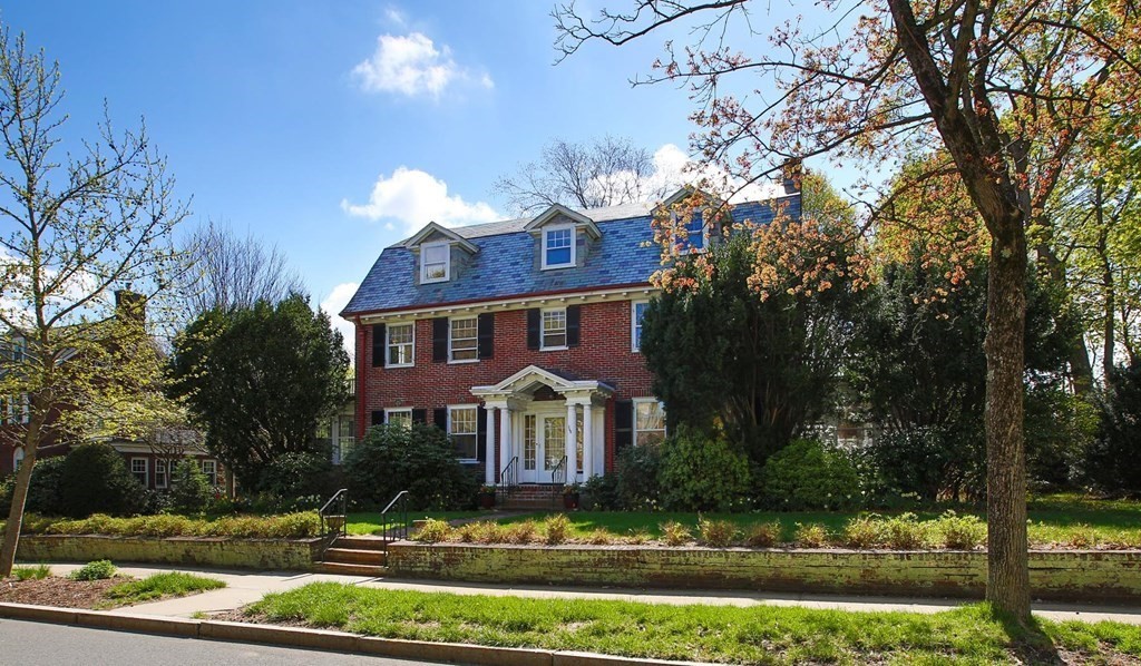 260 Dean Road Brookline, MA 02445 - Photo 2 of 14 a front view of a house with garden