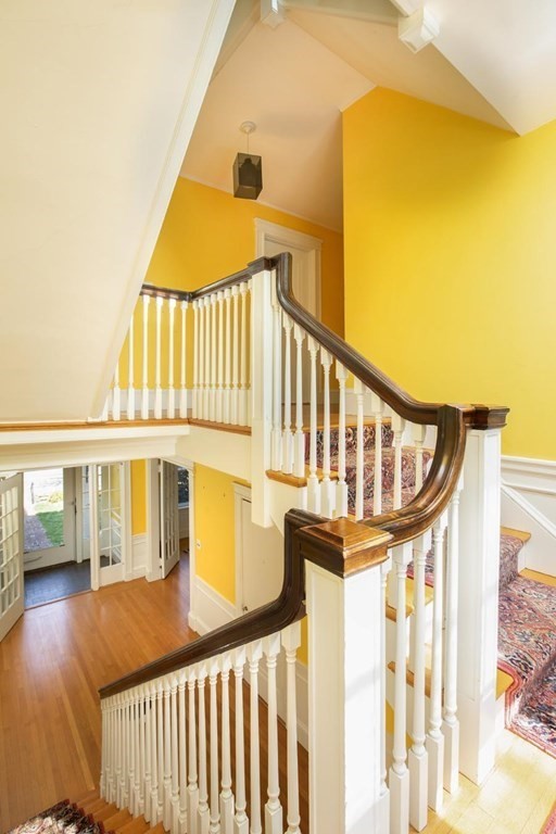 260 Dean Road Brookline, MA 02445 - Photo 5 of 14 a view of a brick house with a wooden fence