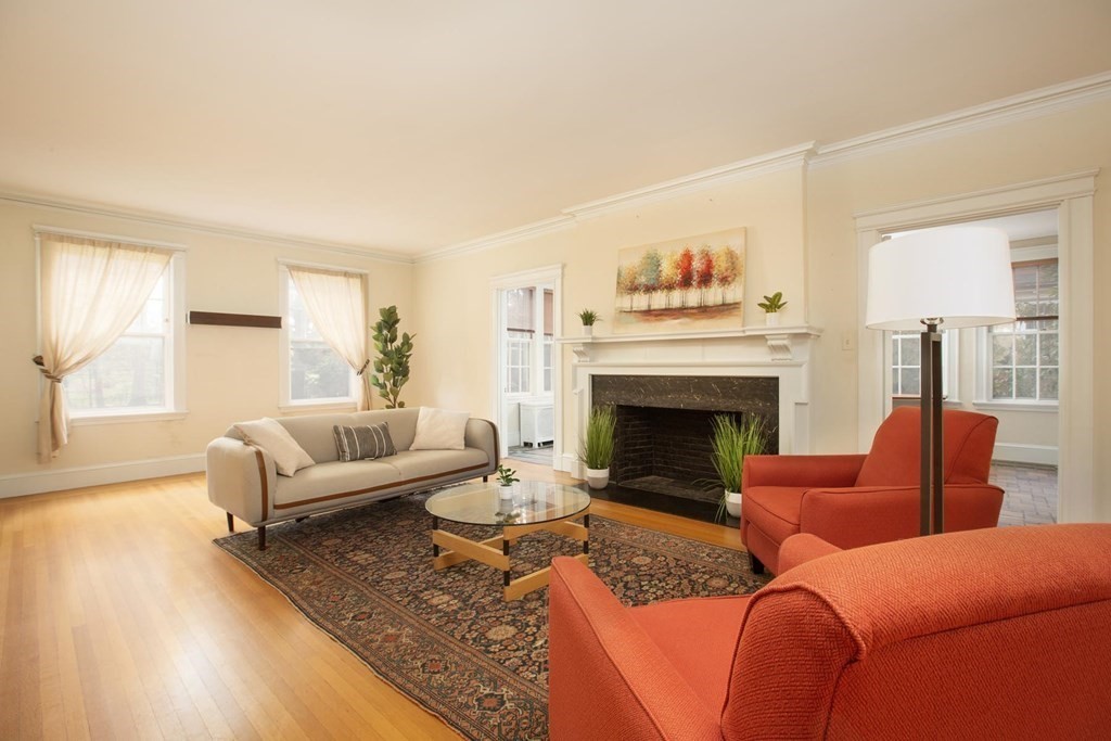 260 Dean Road Brookline, MA 02445 - Photo 6 of 14 a living room with furniture and a fireplace