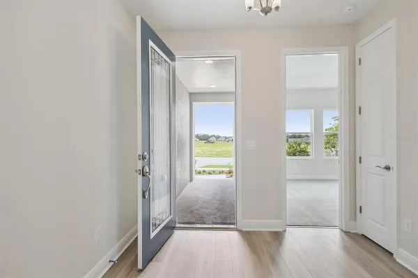 a large kitchen with stainless steel appliances granite countertop a large counter top and a stove top oven