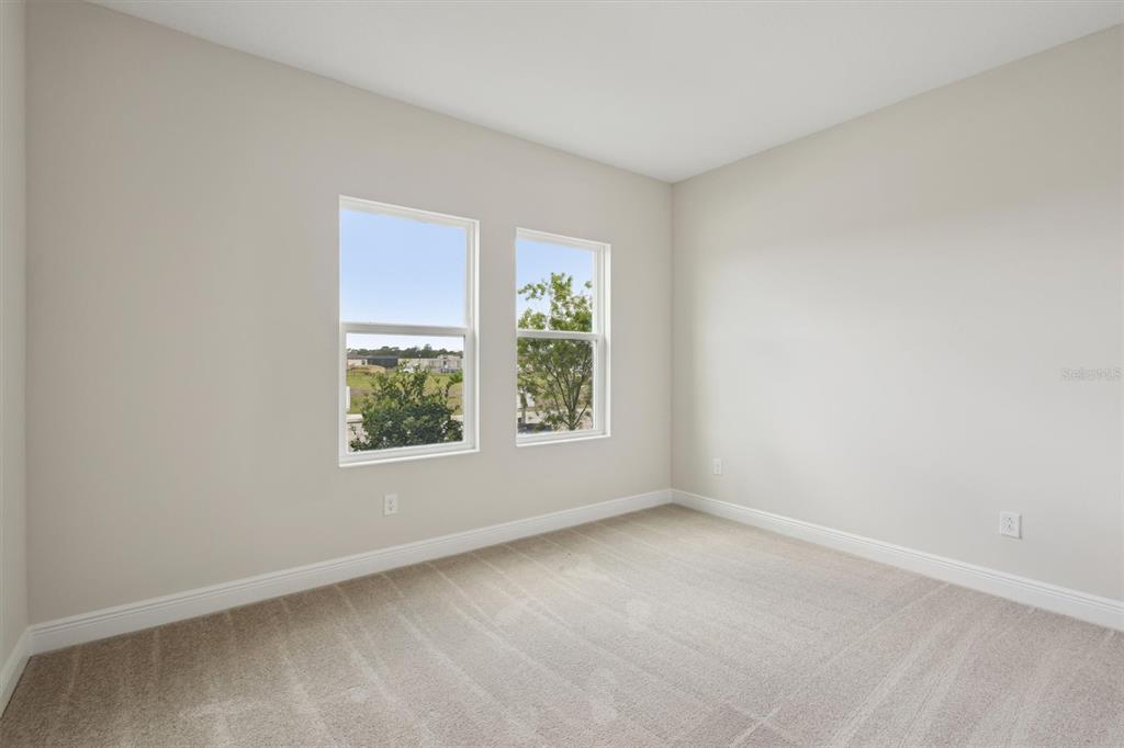 5178 Everlong Drive Apollo Beach, FL 33572 - Photo 16 of 25 an empty room with windows
