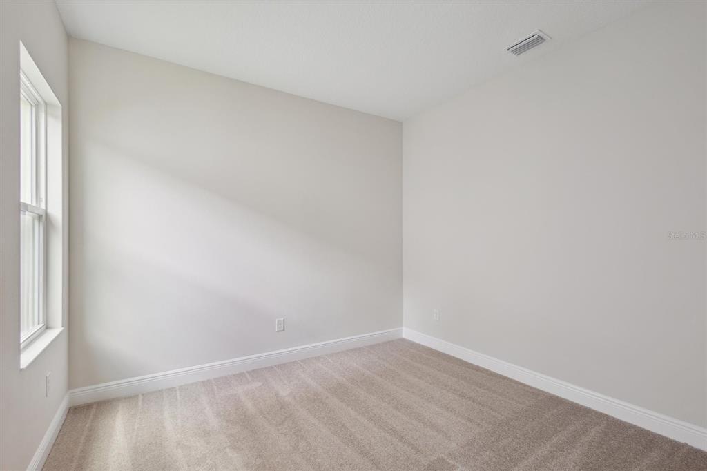 5178 Everlong Drive Apollo Beach, FL 33572 - Photo 17 of 25 a view of an empty room and window