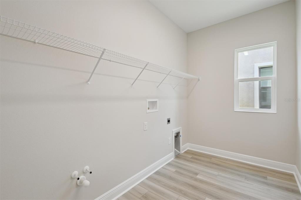 5178 Everlong Drive Apollo Beach, FL 33572 - Photo 22 of 25 a view of a room with wooden floor