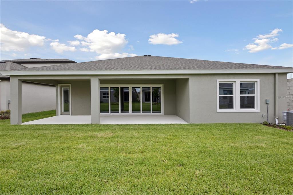 5178 Everlong Drive Apollo Beach, FL 33572 - Photo 24 of 25 a view of a house with a yard