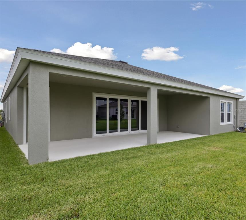 5178 Everlong Drive Apollo Beach, FL 33572 - Photo 25 of 25 a view of an house with backyard space and garden
