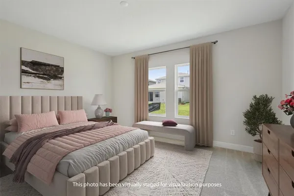 a bedroom with a bed and a couch