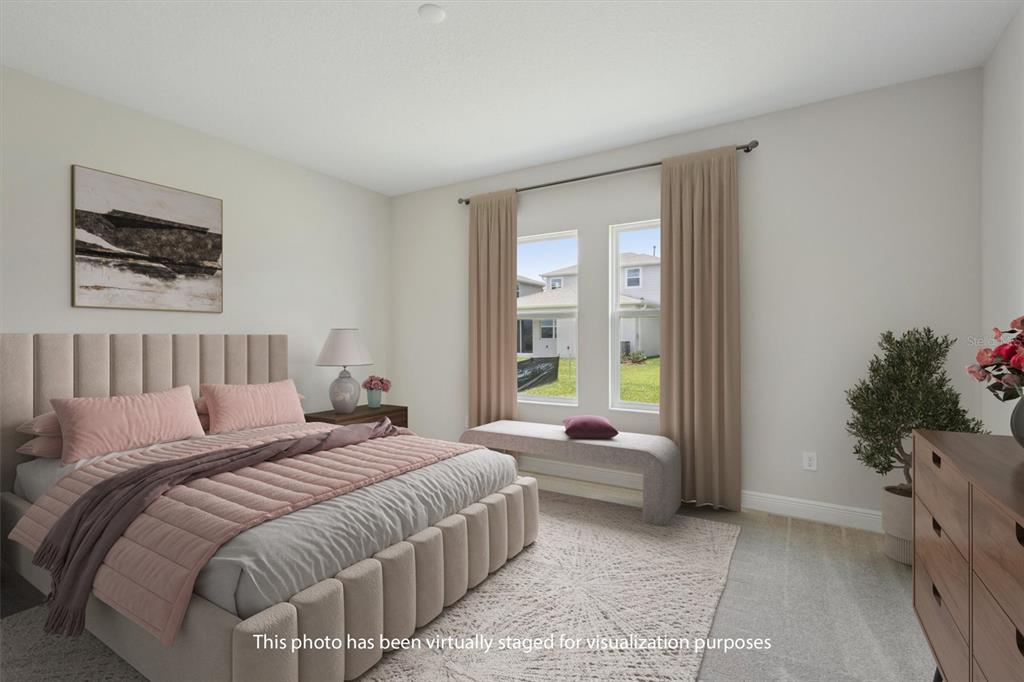 5178 Everlong Drive Apollo Beach, FL 33572 - Photo 4 of 25 a bedroom with a bed and a couch