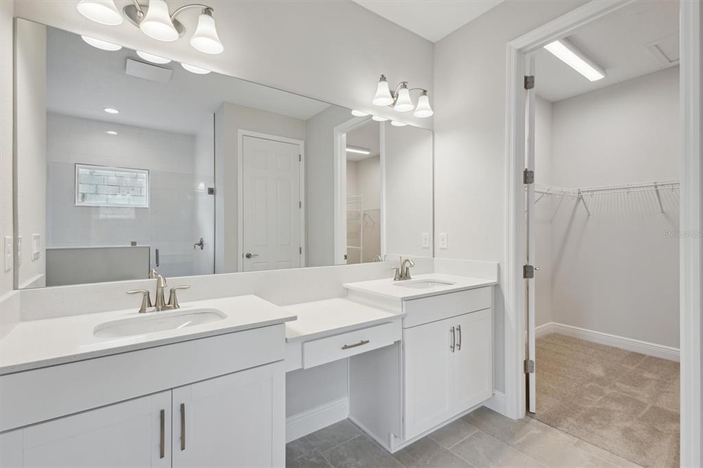 5178 Everlong Drive Apollo Beach, FL 33572 - Photo 8 of 25 a bathroom with a sink double vanity and a mirror