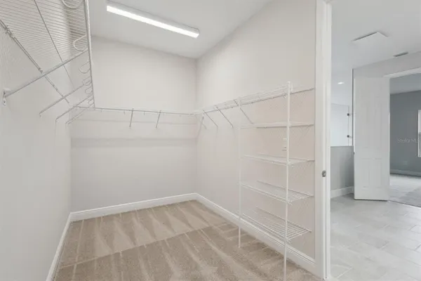 a view of a room with racks on the wall