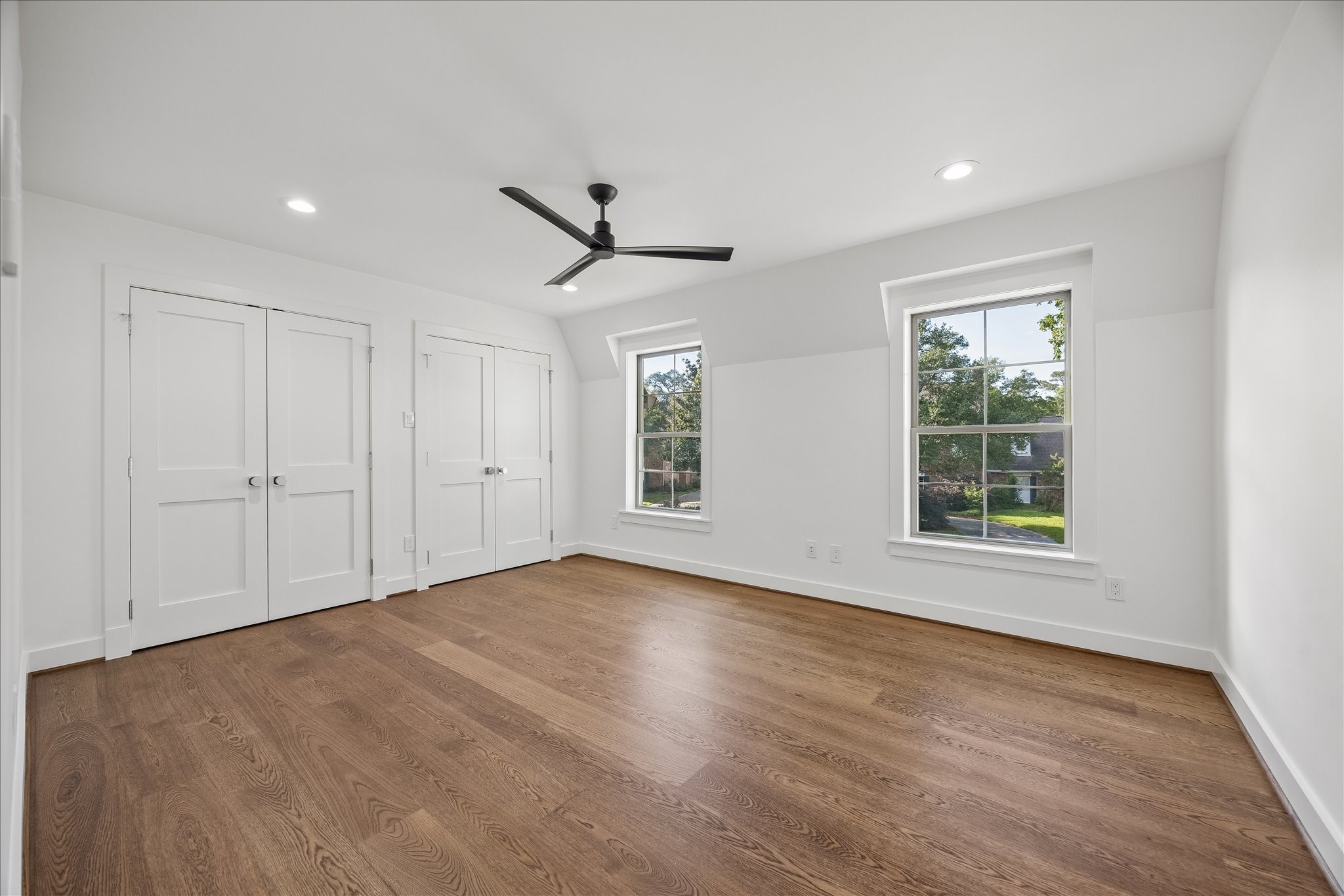 620 Stoneleigh Drive Houston, TX 77079 - Photo 29 of 39 Generous secondary bedroom paired with a thoughtfully designed custom closet, blending functionality with a polished finish.
