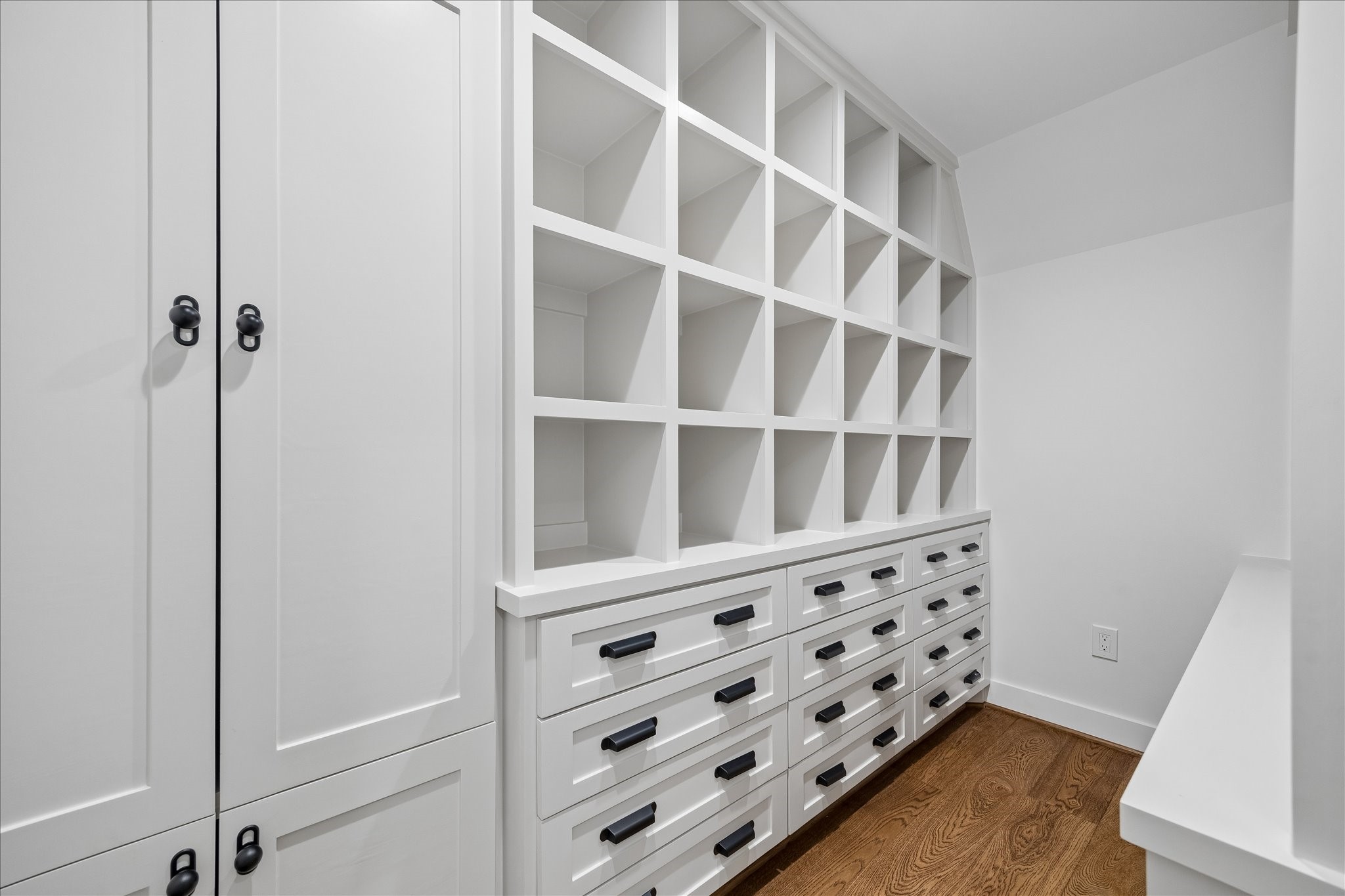 620 Stoneleigh Drive Houston, TX 77079 - Photo 30 of 39 A thoughtfully designed wrapping and craft closet featuring abundant cubbies, drawers, and cabinet storage to keep everything neatly organized. Complete with a dedicated wrapping station, it offers a functional and inspiring space for projects and gift preparation.