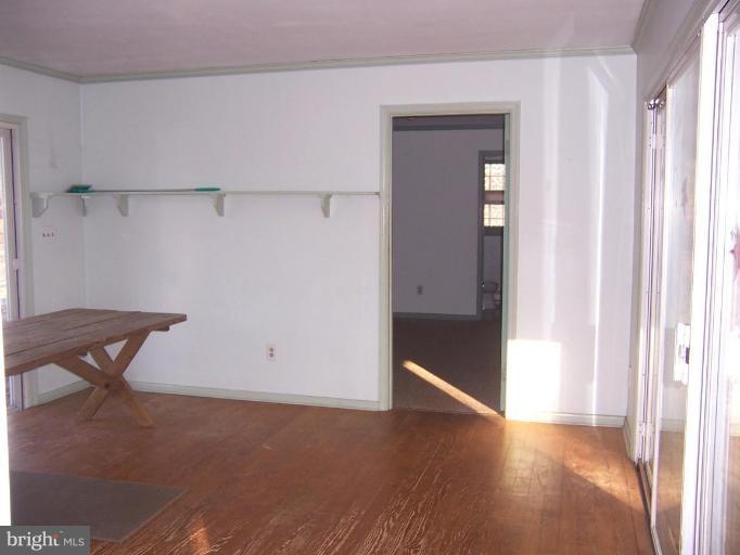 2121 Blue Mt Road Monkton, MD 21111 - Photo 2 of 8 a view of a livingroom with wooden floor and a window