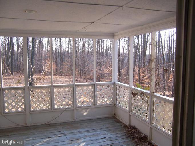 2121 Blue Mt Road Monkton, MD 21111 - Photo 3 of 8 a view of wooden floor and brick walls