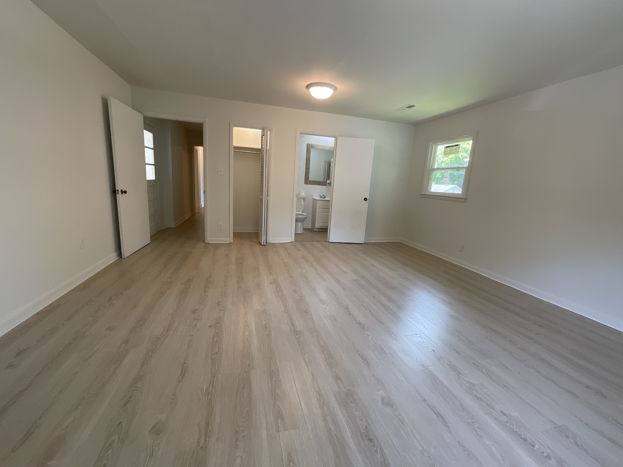 624 Fall River Road Lawrenceburg, TN 38464 - Photo 21 of 22 wooden floor in an empty room with a window
