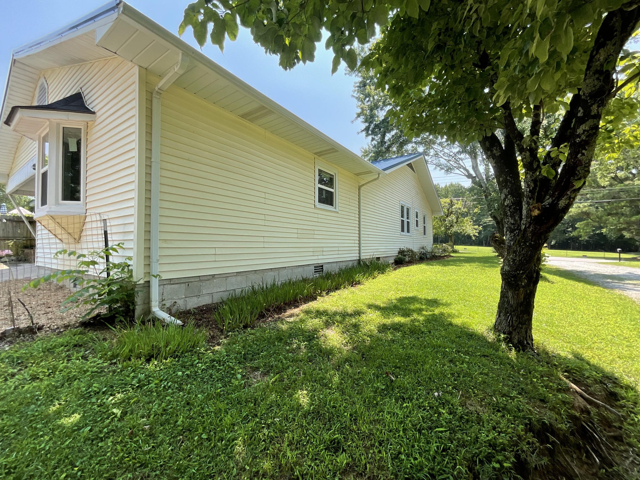 624 Fall River Road Lawrenceburg, TN 38464 - Photo 5 of 22 a view of a house with a backyard