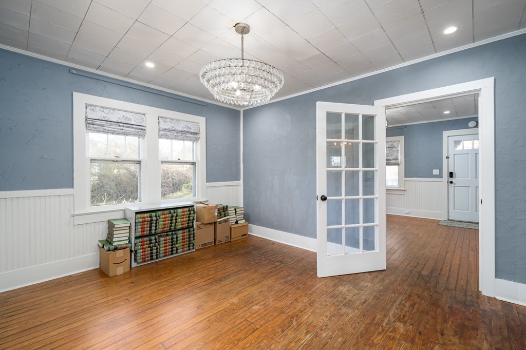 425 West First Street Blue Ridge, GA 30513 - Photo 11 of 33 an empty room with wooden floor and windows