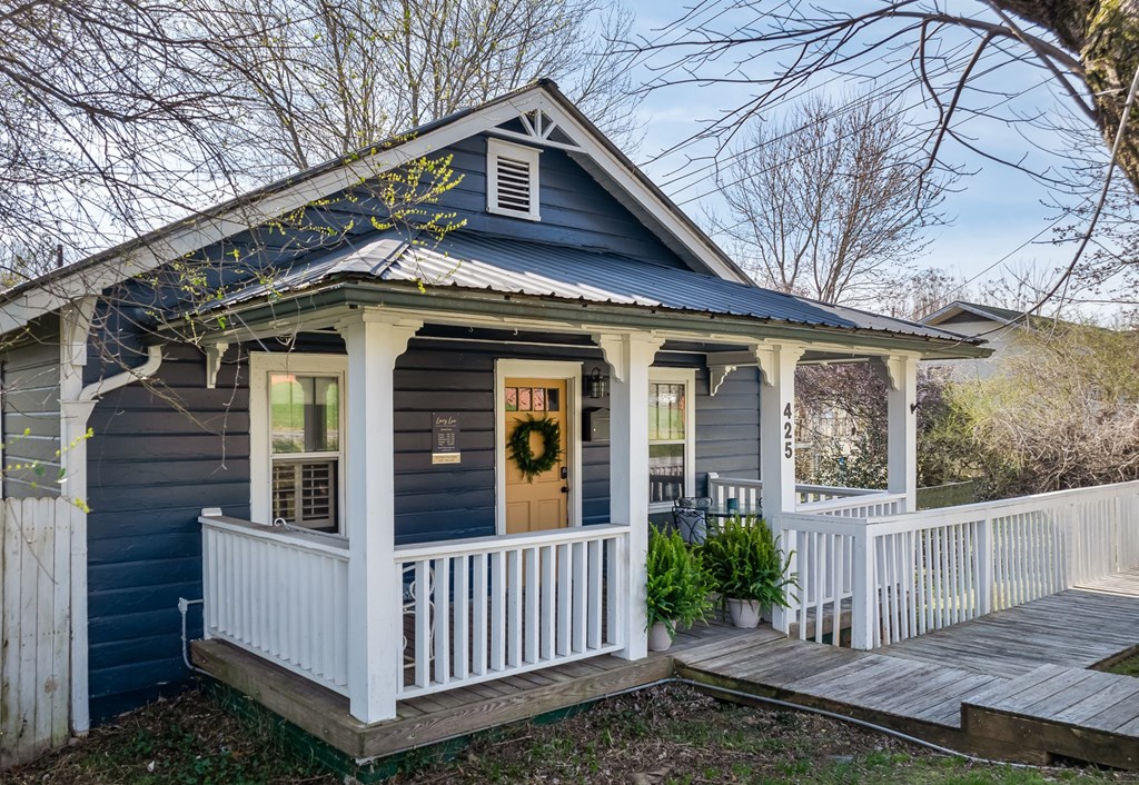 425 West First Street Blue Ridge, GA 30513 - Photo 3 of 33 a view of a house with wooden fence and floor