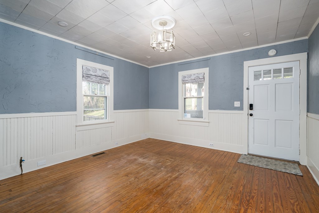 425 West First Street Blue Ridge, GA 30513 - Photo 5 of 33 wooden floor in an empty room with a window