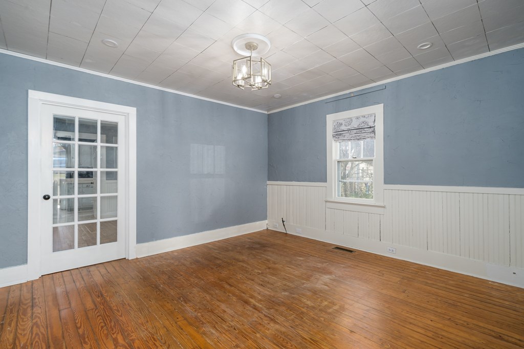 425 West First Street Blue Ridge, GA 30513 - Photo 6 of 33 a view of an empty room with a window and wooden floor