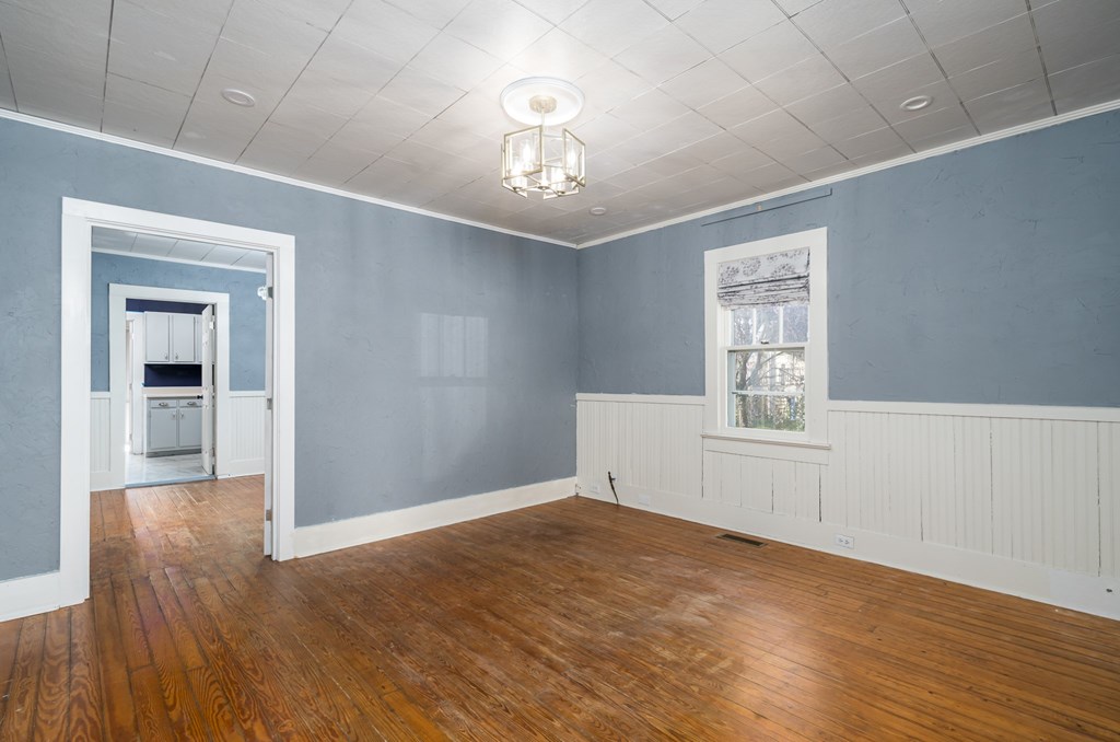 425 West First Street Blue Ridge, GA 30513 - Photo 7 of 33 wooden floor in an empty room with a window