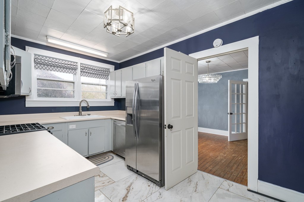 425 West First Street Blue Ridge, GA 30513 - Photo 10 of 33 a kitchen with a refrigerator a sink and cabinets