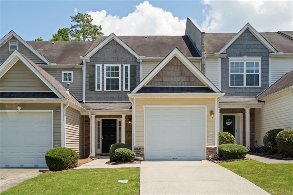 5309 Paramount View Way Northeast Sugar Hill, GA 30518 - Photo 1 of 1 a front view of a house with a yard and porch