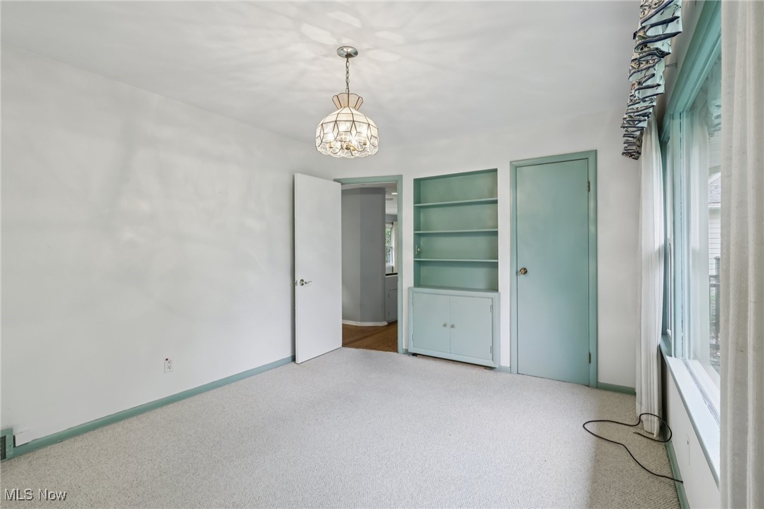 33300 South Woodland Road Cleveland, OH 44124 - Photo 30 of 50 Unfurnished bedroom with carpet flooring and a chandelier