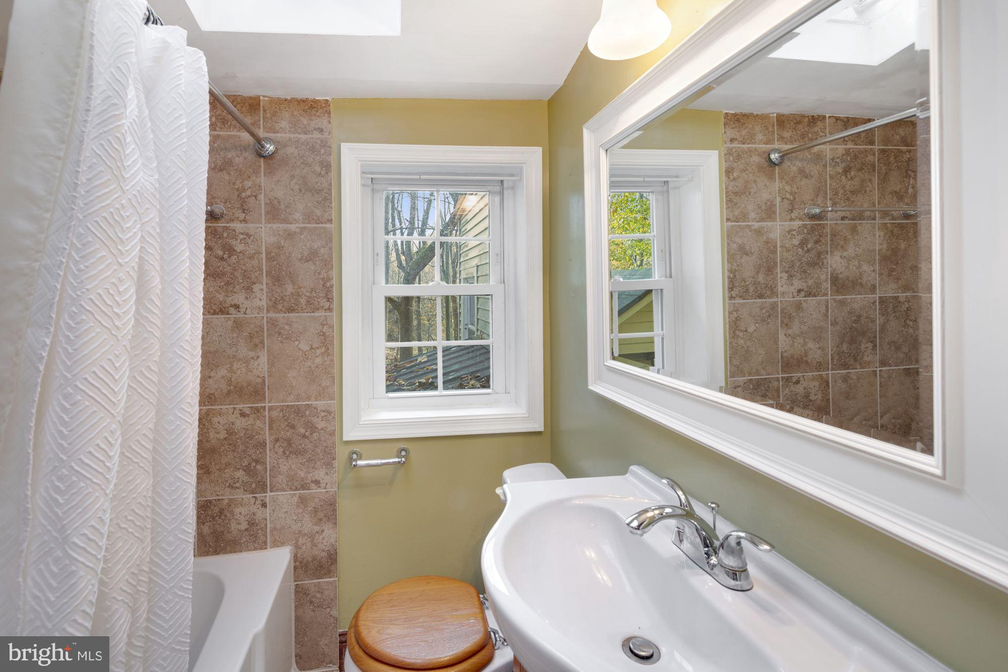 41788 Stumptown Road Leesburg, VA 20176 - Photo 27 of 31 a bathroom with a sink and a toilet