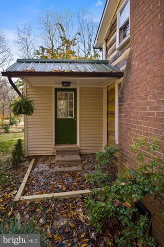 a view of a house with a small yard and plants