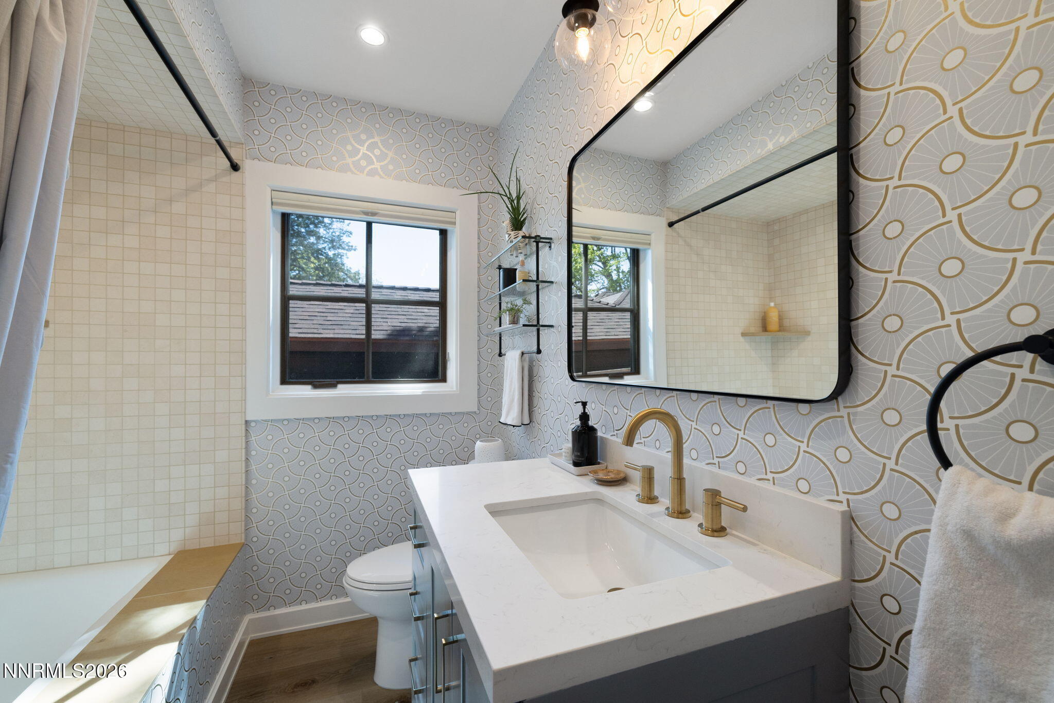 210 Bret Harte Avenue Reno, NV 89509 - Photo 23 of 40 a bathroom with a sink mirror and toilet
