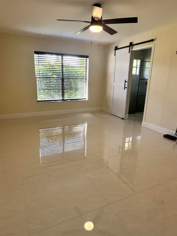 a view of an empty room with a window