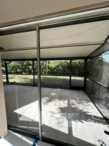 a view of a living room and window in a room