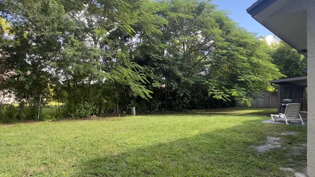 a view of outdoor space with deck and yard