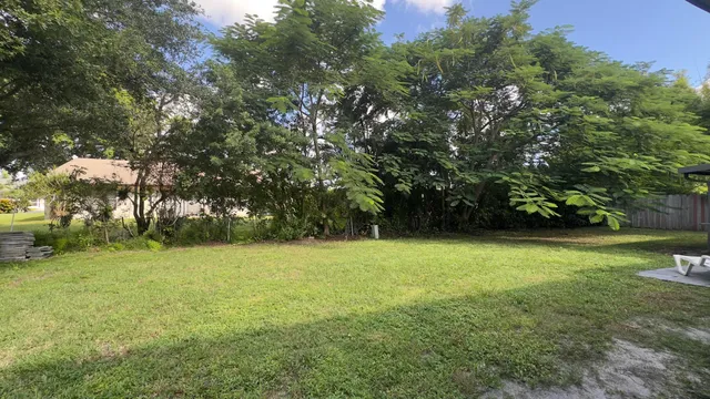 a view of field with trees in the background